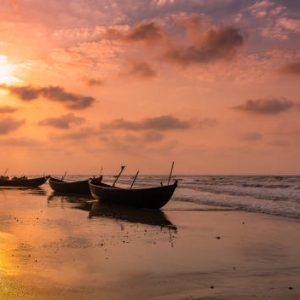 Fishing Boats anchored on the  seashore .